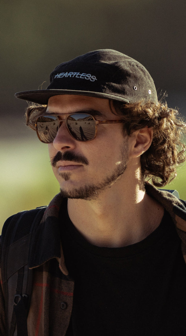 Man wears VALLON Howlin' sunglasses with Category 3 sun protection for spring hiking