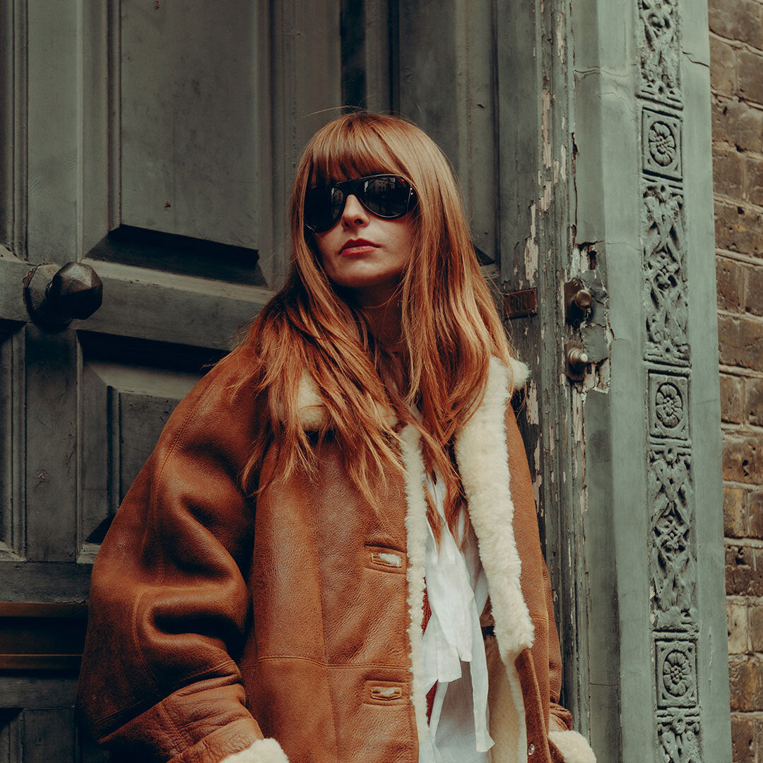 Woman wears Royal Enfield Special Edition Moto Aviators from VALLON
