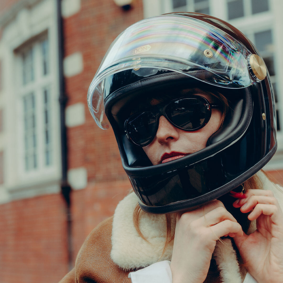 Woman wears Royal Enfield Special Edition Moto Aviators from VALLON with motorbiking helmet