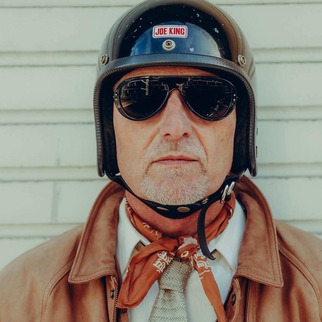70s-styled motorcyclist wearing Royal Enfield Special Edition Moto Aviators from VALLON