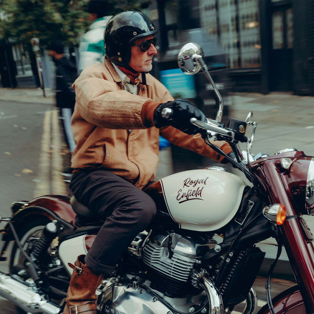 Man wearing Black-Smoke Royal Enfield Special Edition Moto Aviators from VALLON on a motorbike