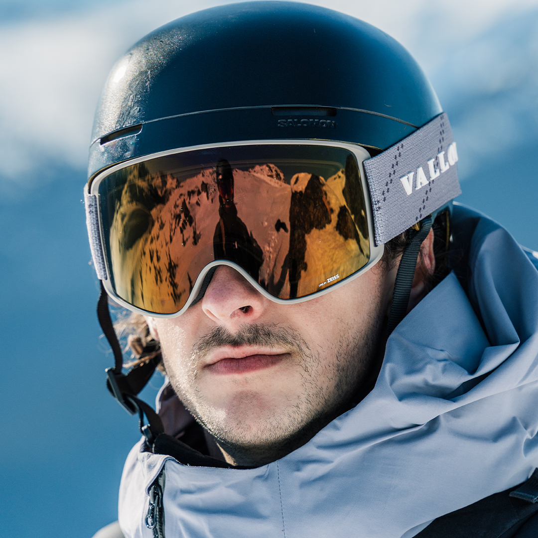 Male skier wears Sand-Copper Crossroads ski goggles from VALLON
