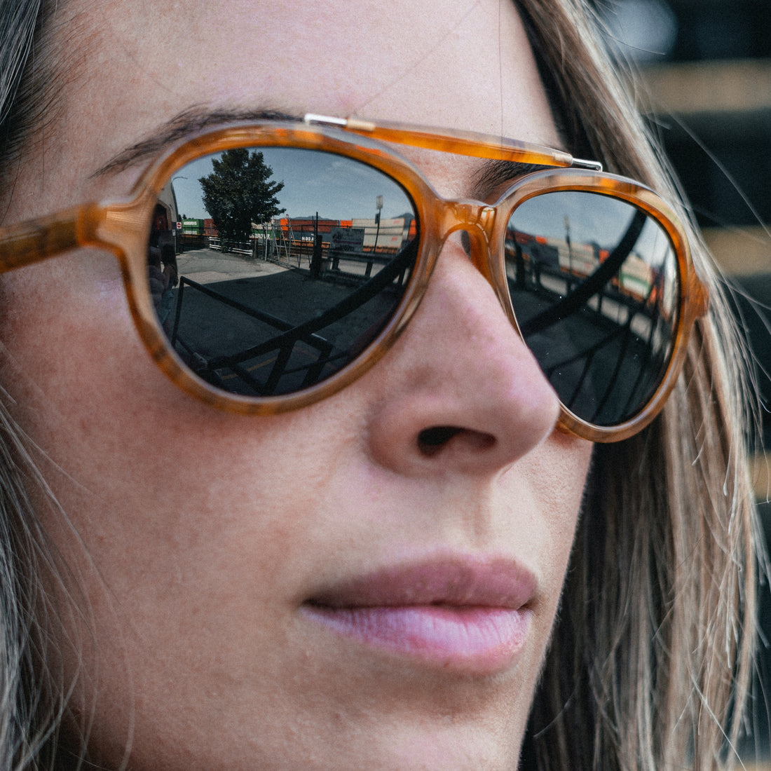 Side view of woman wearing Ella Horn polarized brow-bar aviator sunglasses from VALLON