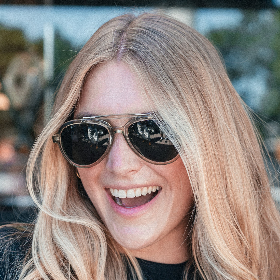 Women wears Ella Sage polarized brow-bar aviator sunglasses from VALLON