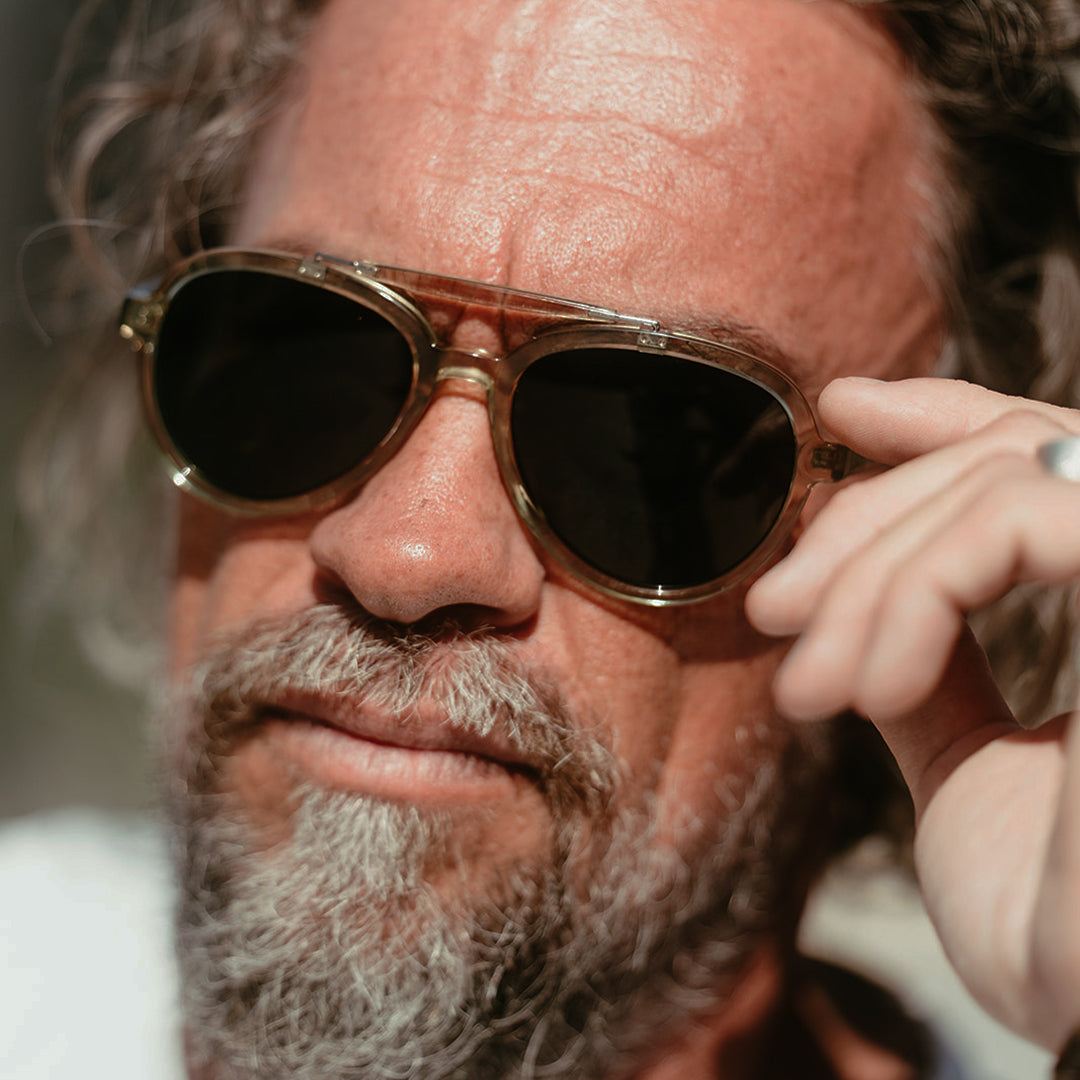 Man wears Elmore sunglasses from VALLON. Aviator sunglasses with brow-bar design, V52 optics and sports versatility