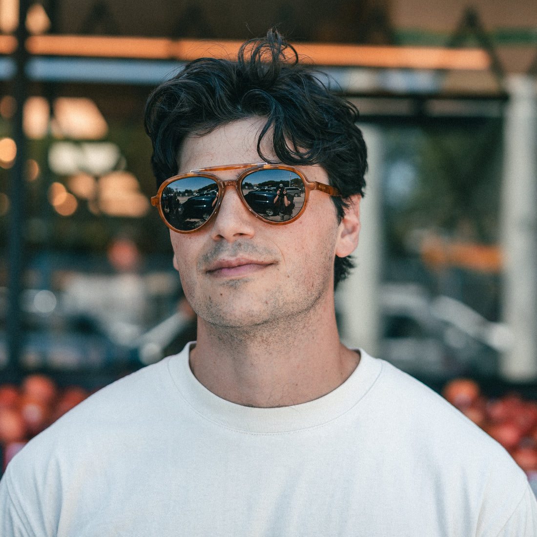 Man wearing a white t-shirt wears VALLON Elmore aviator sunglasses for men