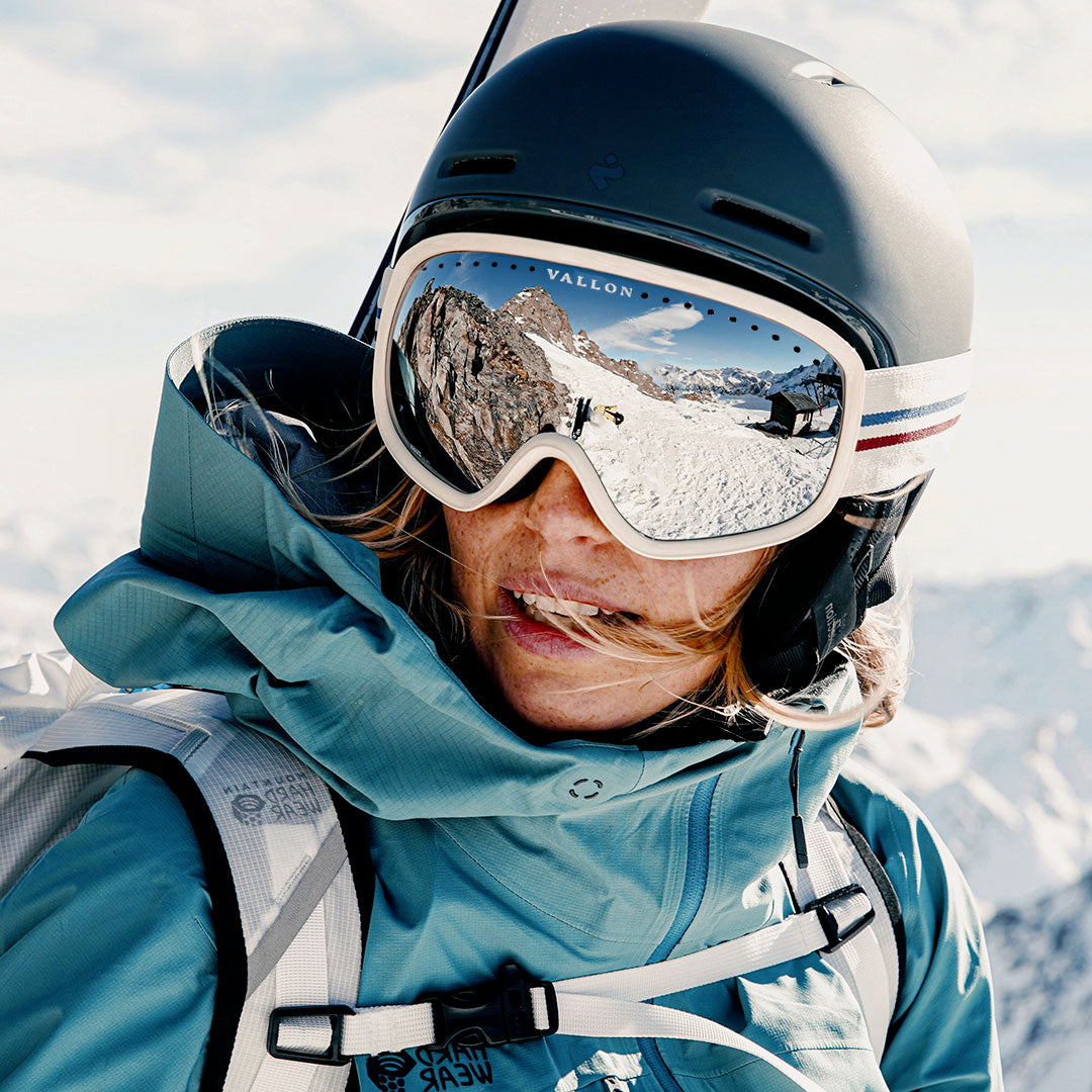 Woman wears Classic 80s-style Freebirds ski goggles from VALLON. Best goggles for skiing