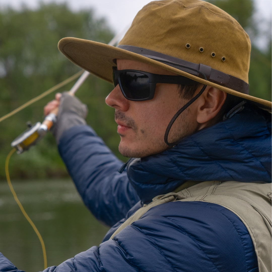 Man wears VALLON Freshwater Revivals for river fishing