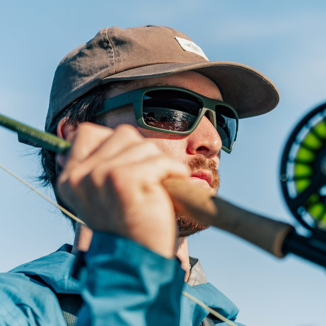 Man wears VALLON Freshwater Revivals polarized sunglasses for fishing