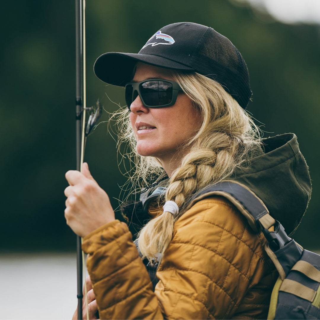 Woman wears VALLON Freshwater Revivals sunglasses for in-shore fishing