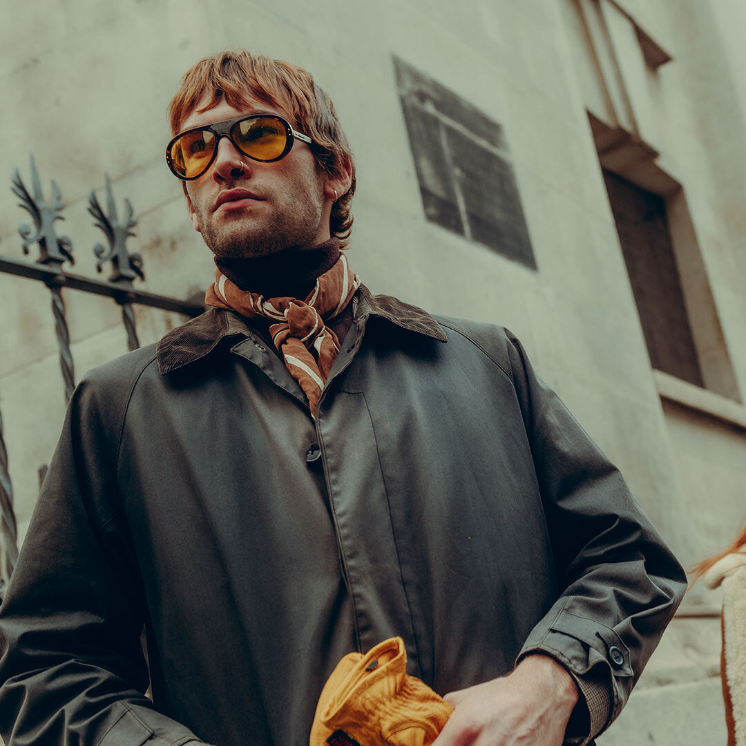 Man wears Royal Enfield Special Edition Moto Aviators from VALLON in Dark Tortoise-Yellow