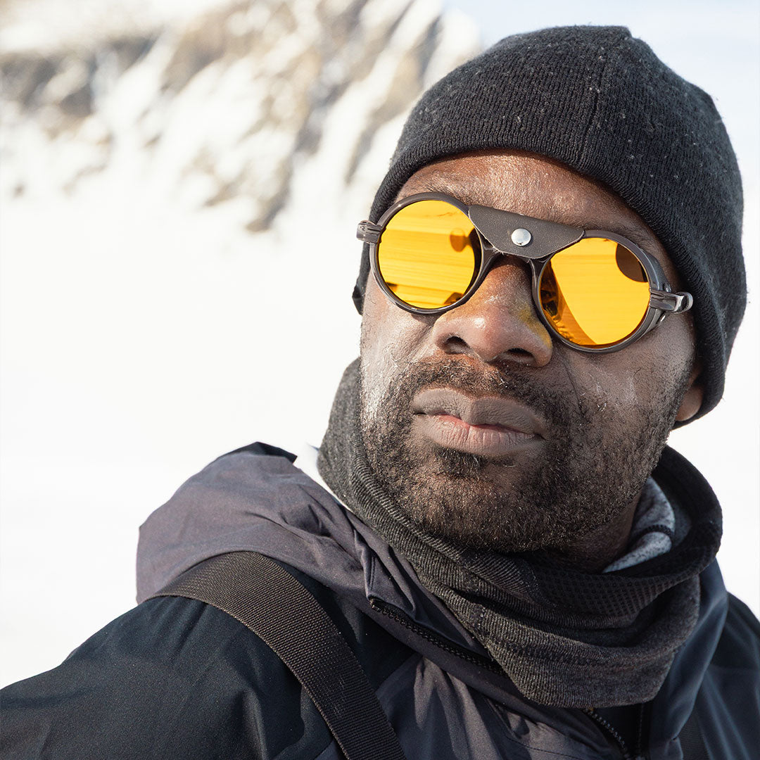 Man wears VALLON Heron Glacier Cat. 4 sunglasses on a polar expedition