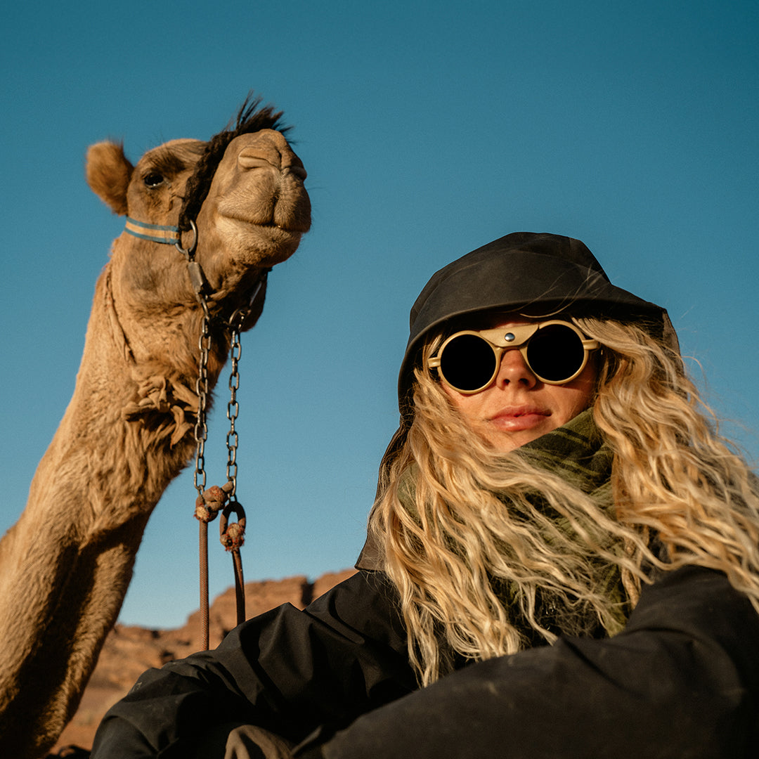 Woman wears Heron Desert polarized side shield sunglasses with Cat. 3 protection for desert adventures from VALLON