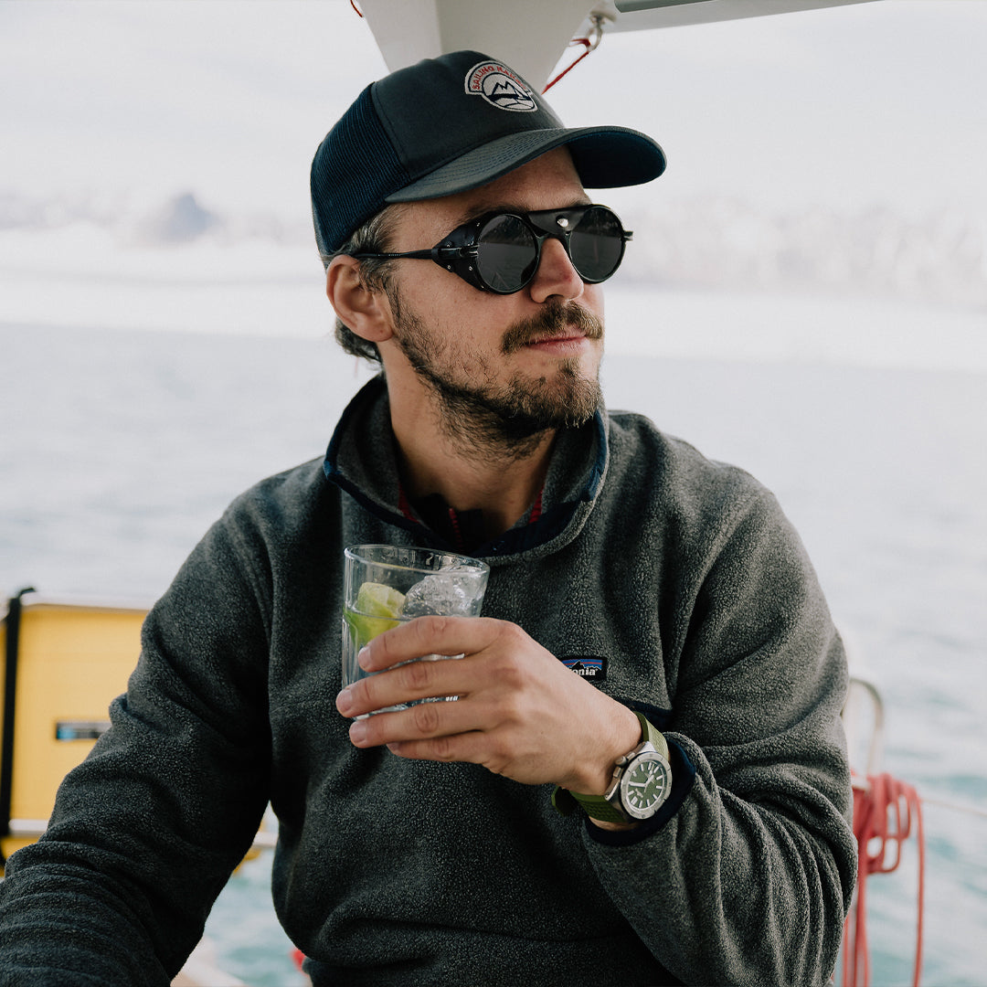 Man wears Heron Ocean side shield sunglasses from VALLON