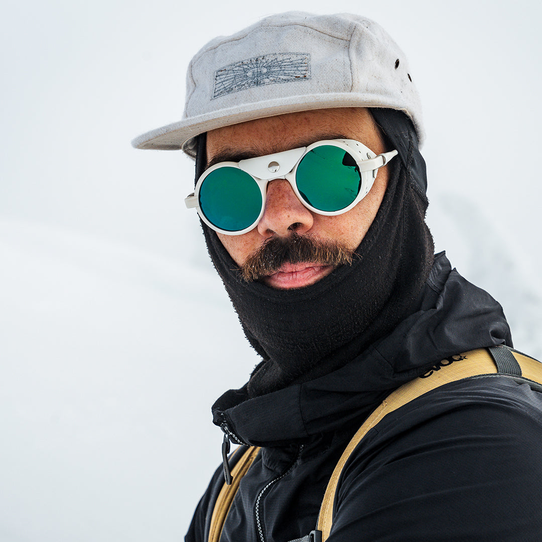 Man wears Heron Glacier Cat. 4 sunglasses from VALLON for skiing