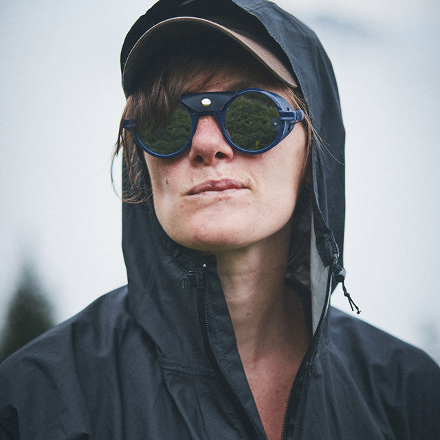 Woman wears VALLON Heron Ocean sunglasses in blue