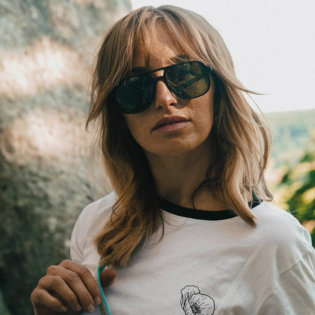 Woman wears VALLON Howlin' sunglasses for an oversized classic aviator look