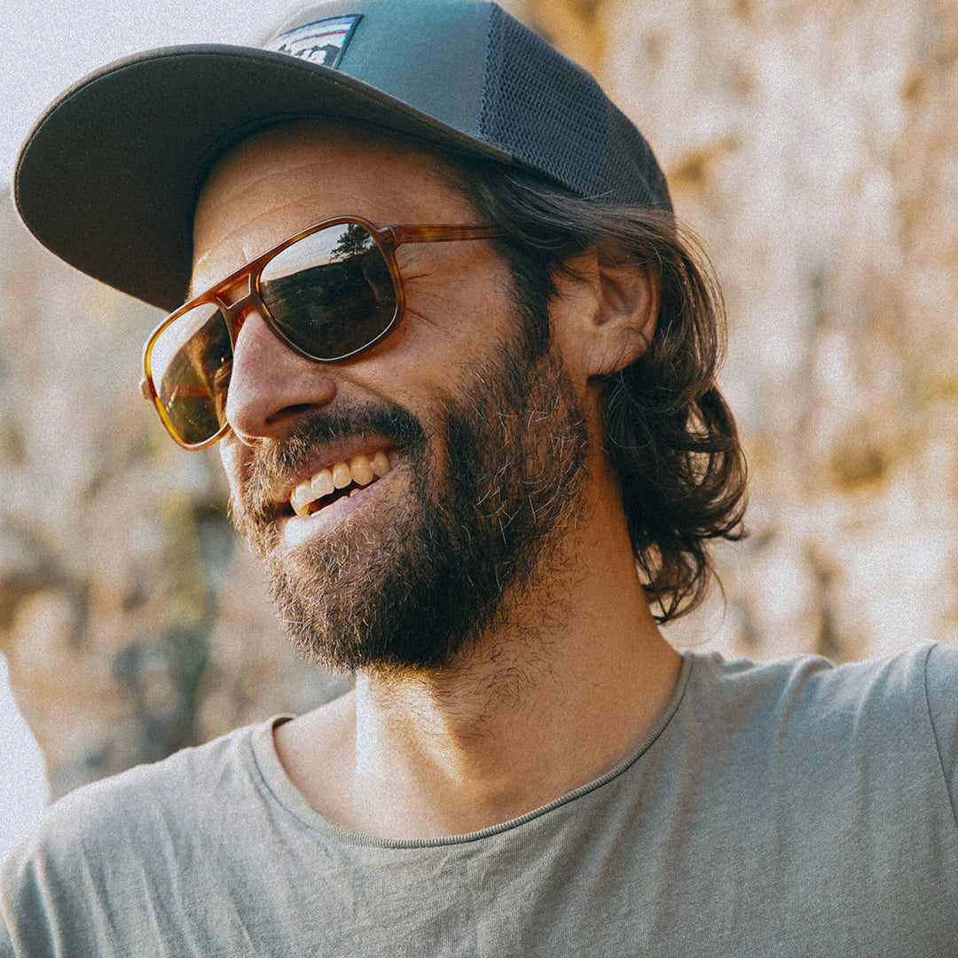 Man wears VALLON Howlin' sunglasses for climbing