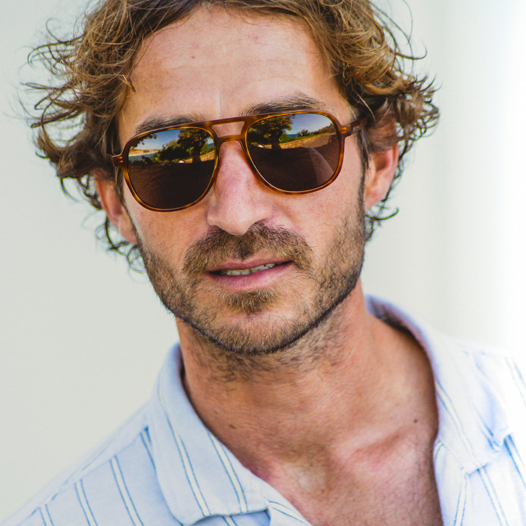 Man wears classic Howlin' aviator sunglasses from VALLON
