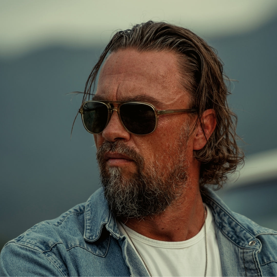 Man wears VALLON Howlin' Cat. 3 sunglasses in sage