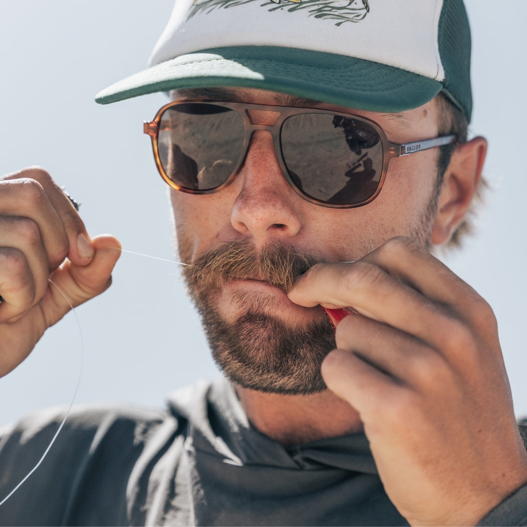 Man wears VALLON Howlin' sunglasses for fishing