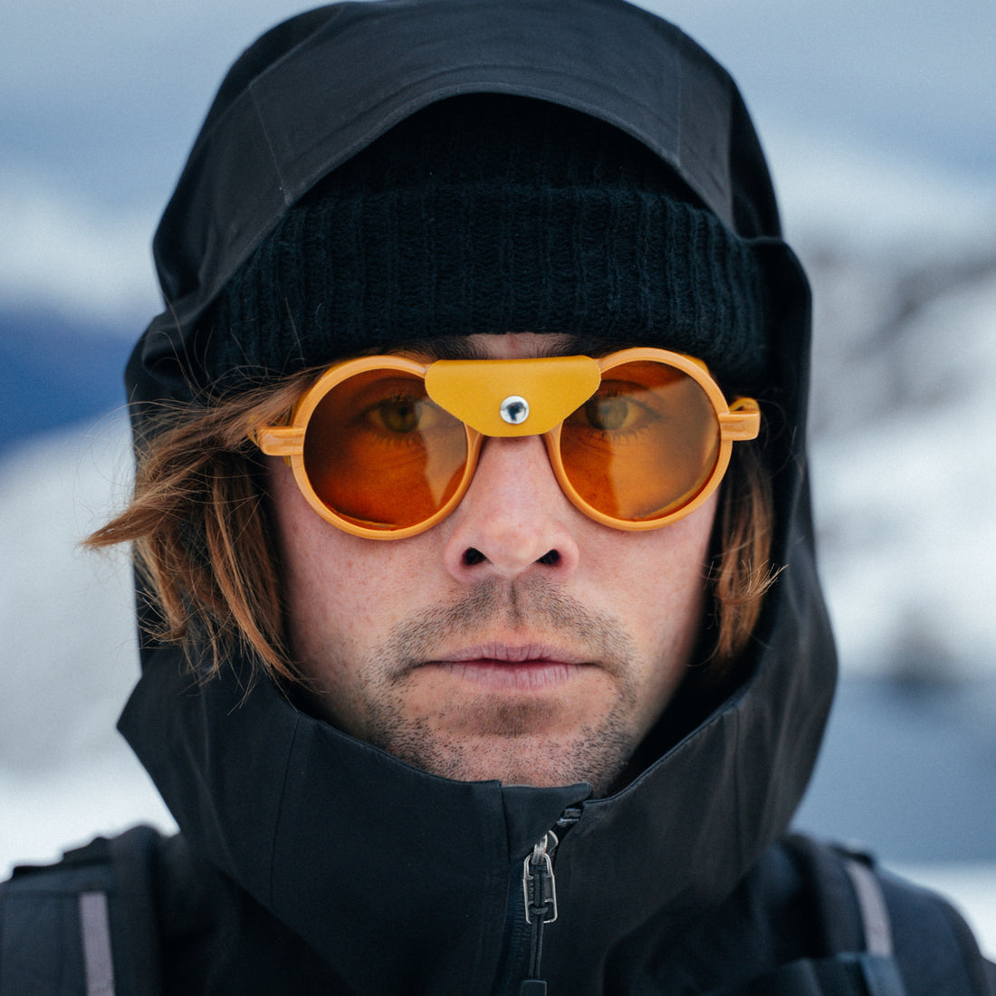 Man wears Heron Glacier Low Light in yellow with yellow Cat. 1 lenses