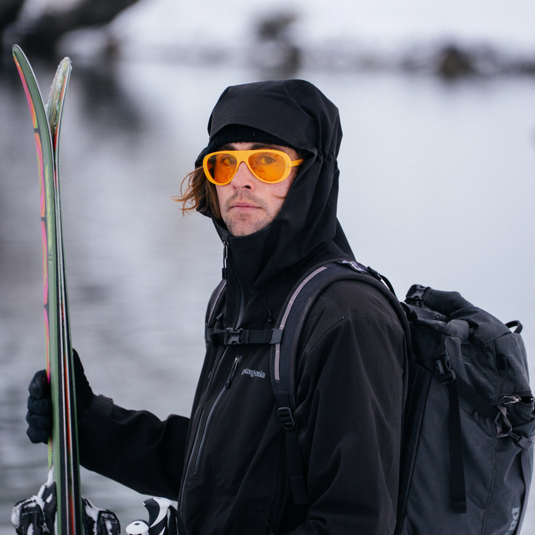 Man wears VALLON Low Light Ski Aviators while skiing in overcast conditions