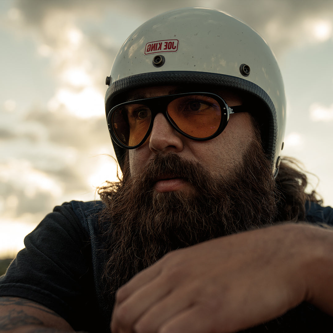 Man wears Black-Yellow Moto Aviators from VALLON with classic motorbiking helmet