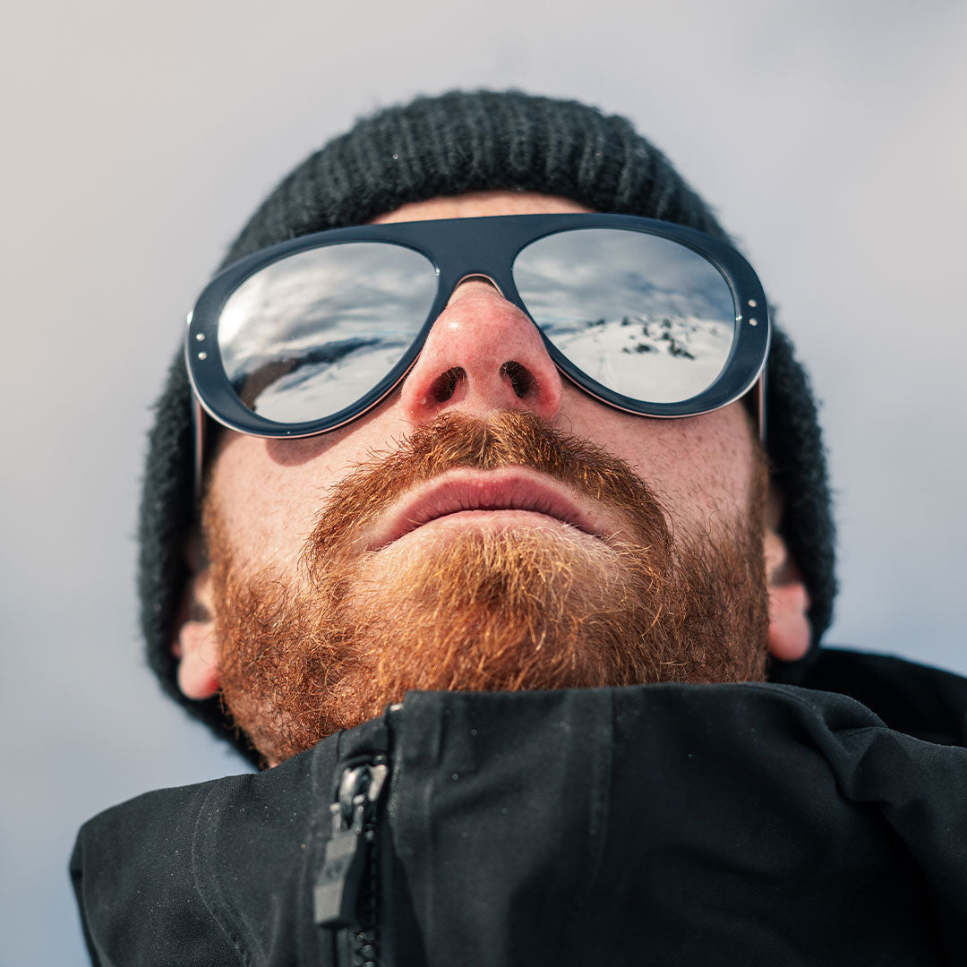 Man wears VALLON Ski Aviators in Blue Tricolor color