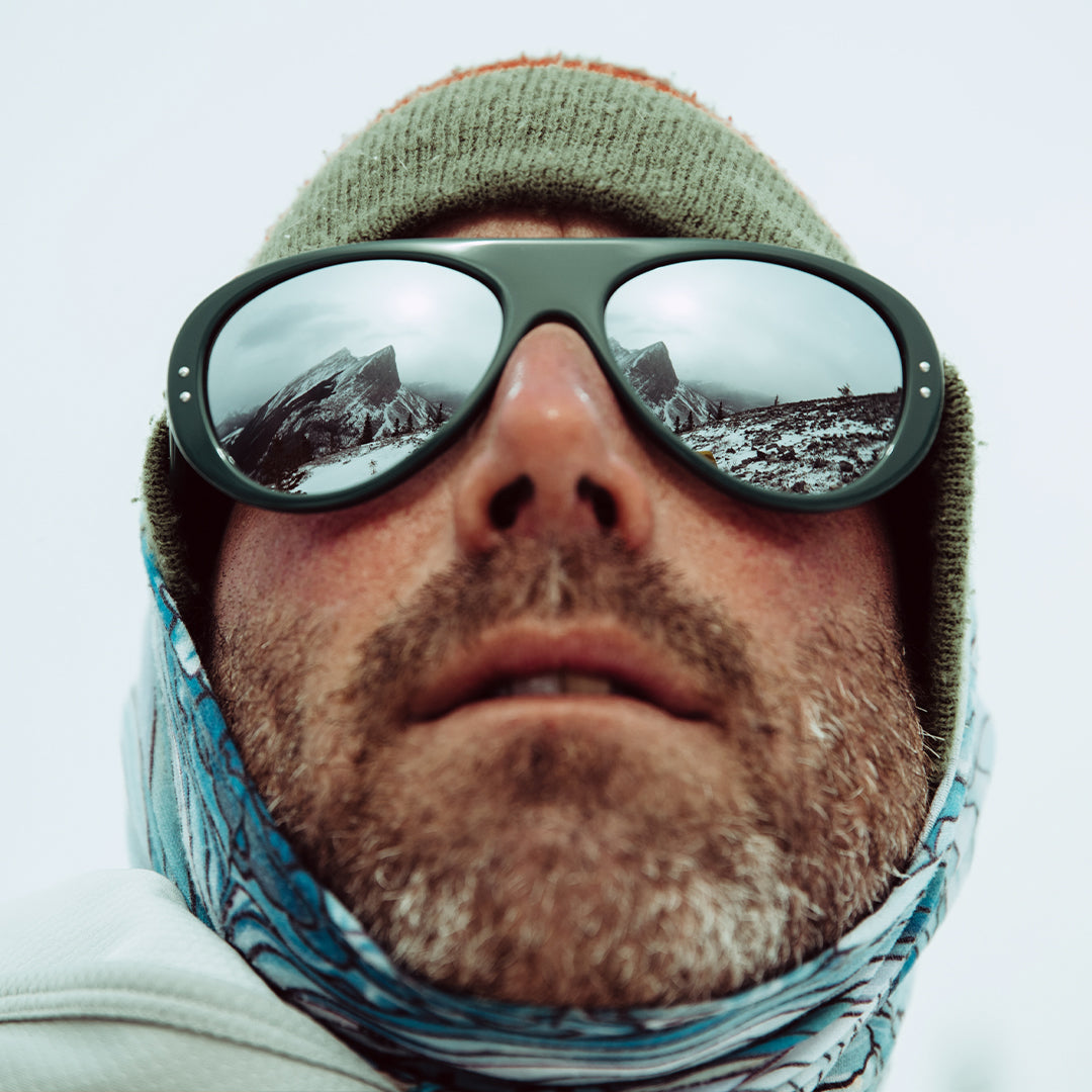 Man wears Ski Aviators sunglasses from VALLON with Rx prescription lenses in classic green