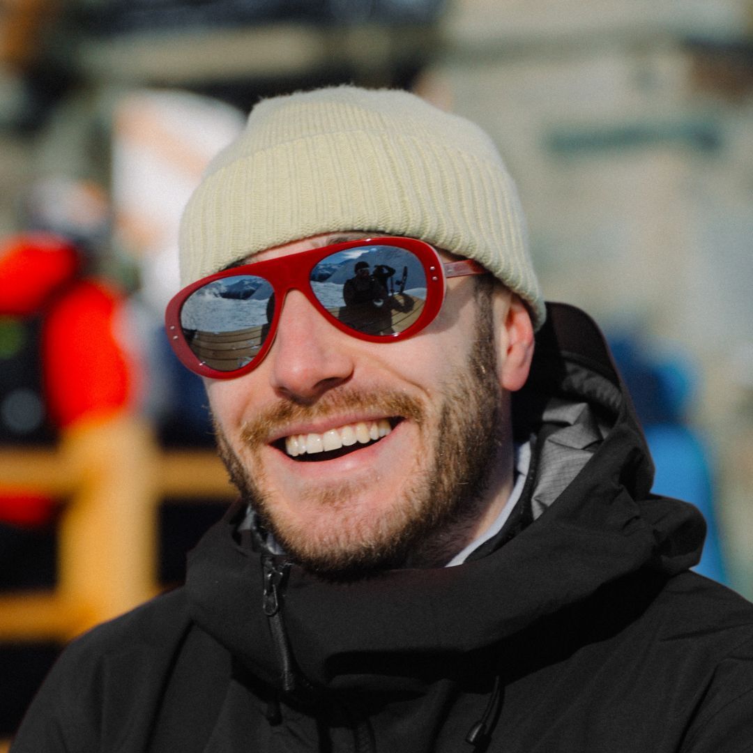 Man wears VALLON Ski Aviators in Tricolor Red with a beanie and ski jacket
