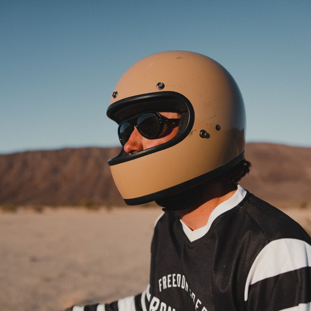 Man wears black Surf Aviators Rx sunglasses from VALLON with motorbiking helmet