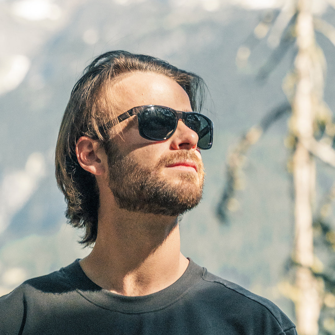 Man wears VALLON sustainable sports sunglasses, the Ventures