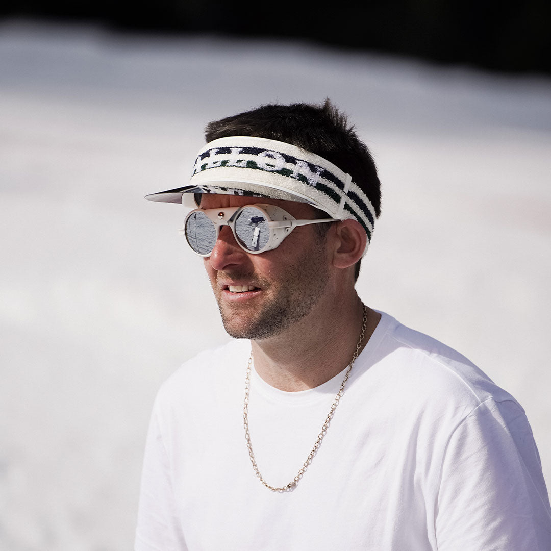Man wears Vizor and Heron Glacier sunglasses from VALLON