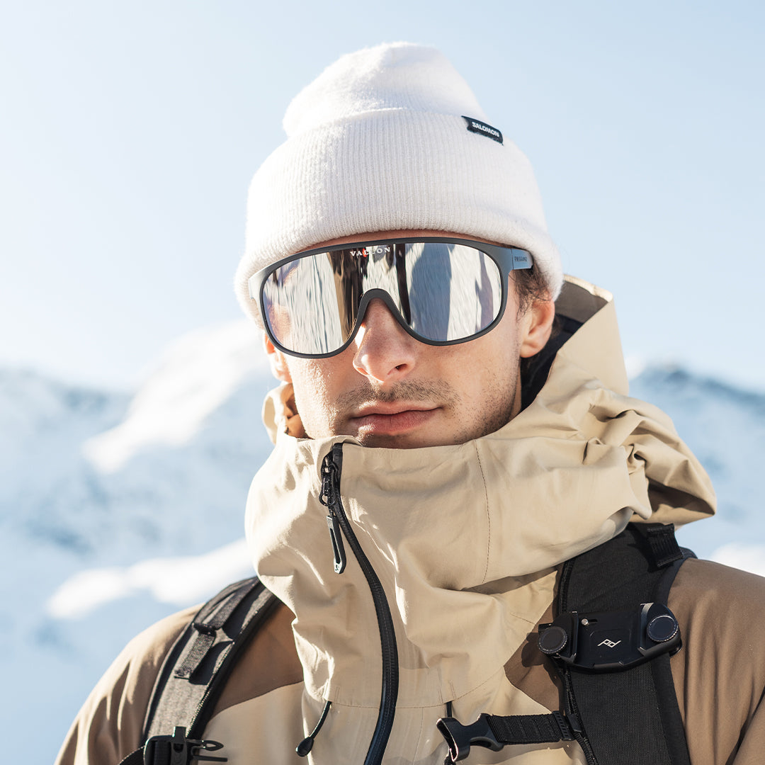 Man wears VALLON Watchtowers sustainable shield sunglasses with ZEISS optics for ski touring