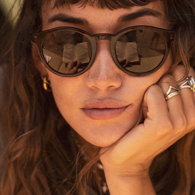 Woman wears Waylons round lifestyle sunglasses from VALLON