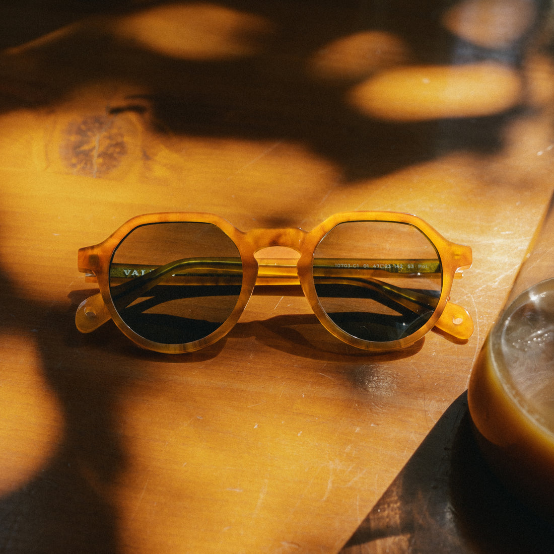 Close-up of Arlo sunglasses on a table