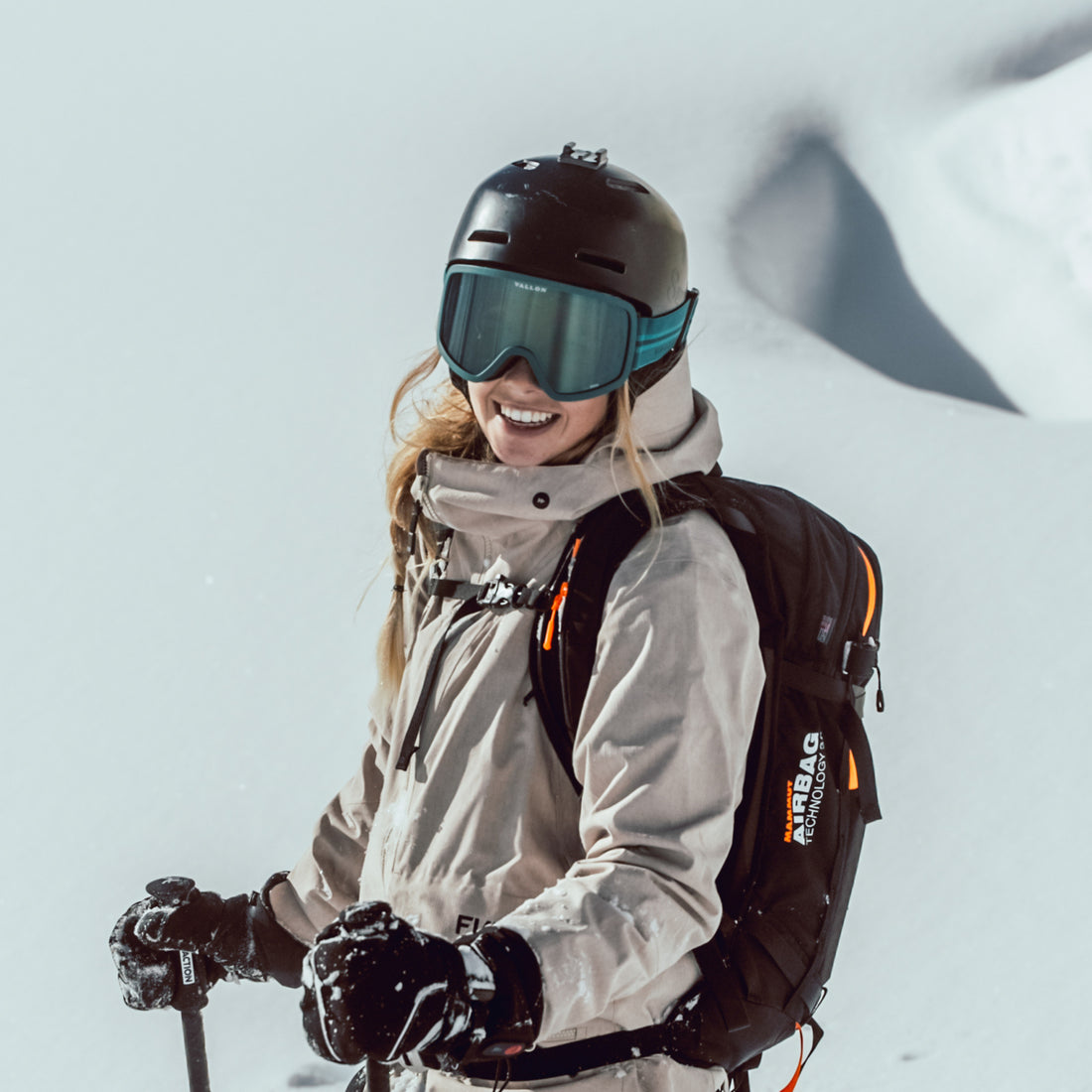 Woman wears Stairways best 80s-inspired ski goggles from VALLON