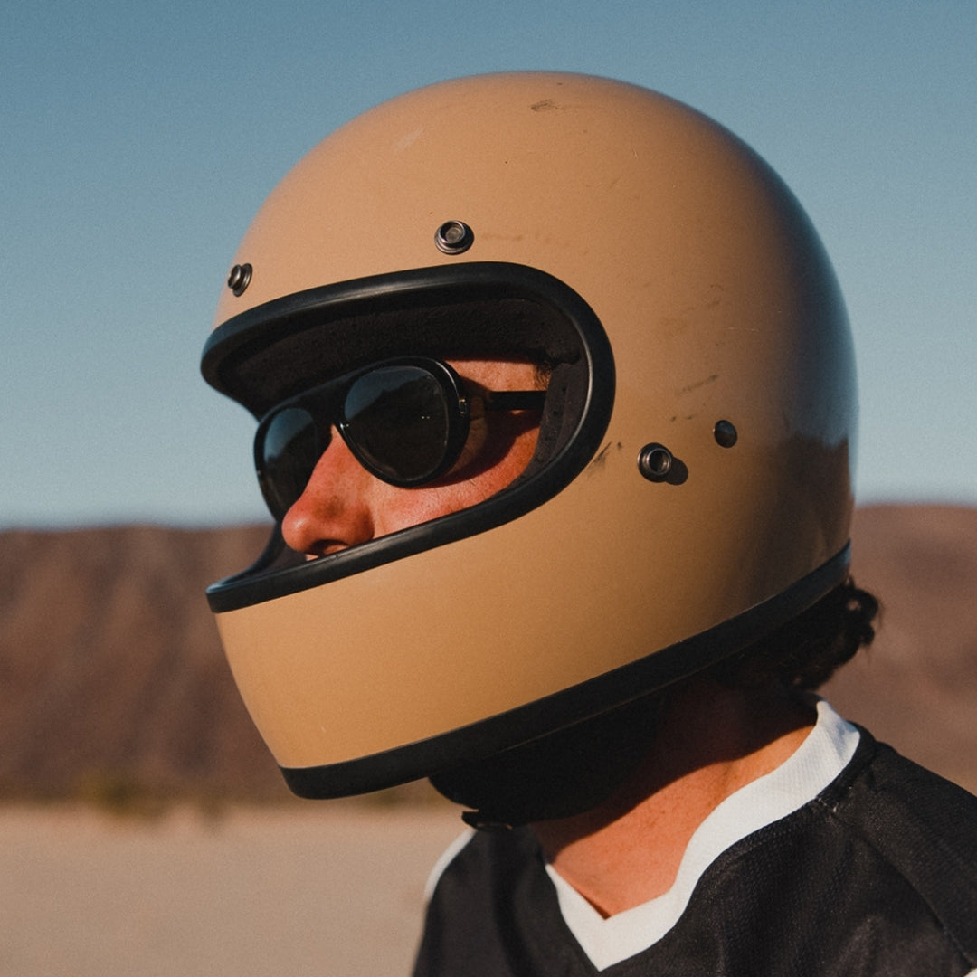 Man wears VALLON Surf Aviators sunglasses with a motorbike helmet
