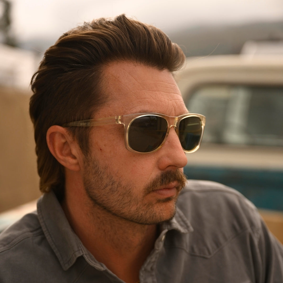 Man wears Ventures sports sunglasses in Sage from VALLON with V52 optics and sustainable lightweight frame