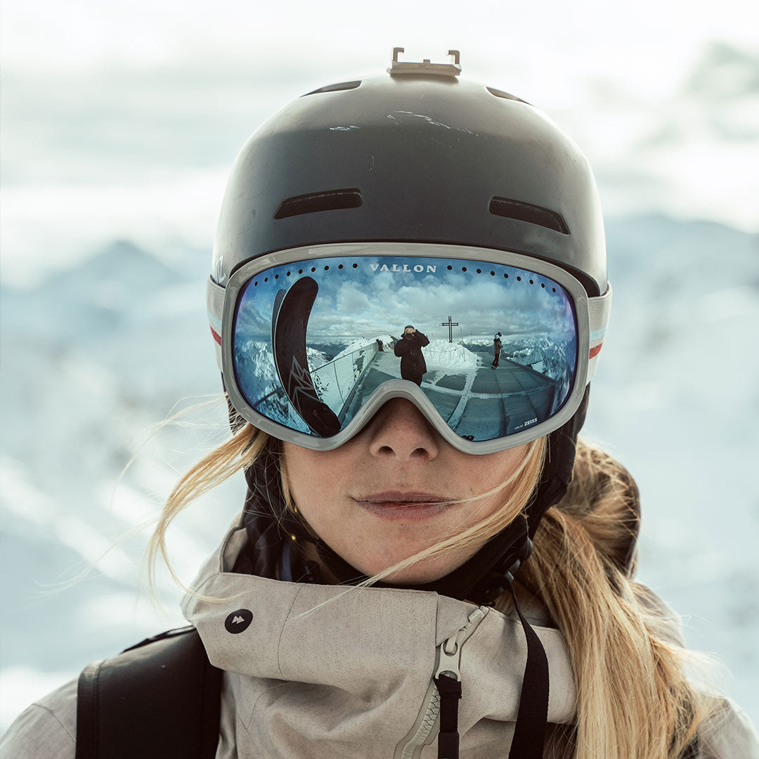 Woman wears VALLON Freebirds ski goggles with helmet