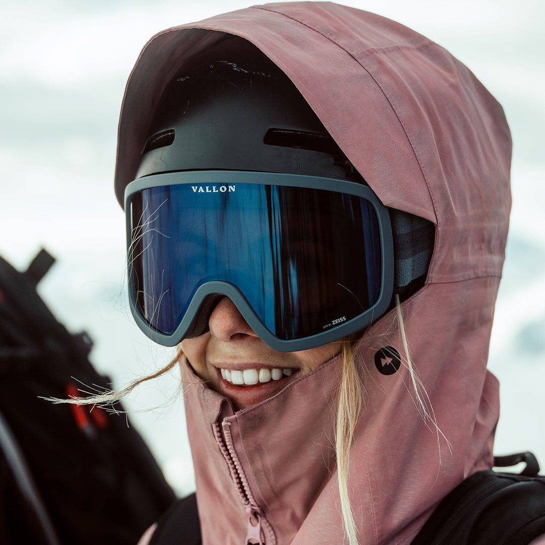 Woman wears Stairways retro-inspired ski goggles from VALLON